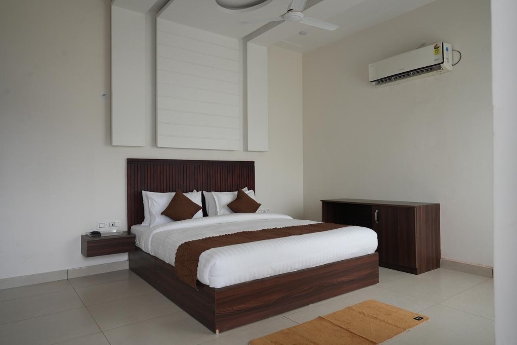 Two-storey accommodation with balcony overlooking gardens